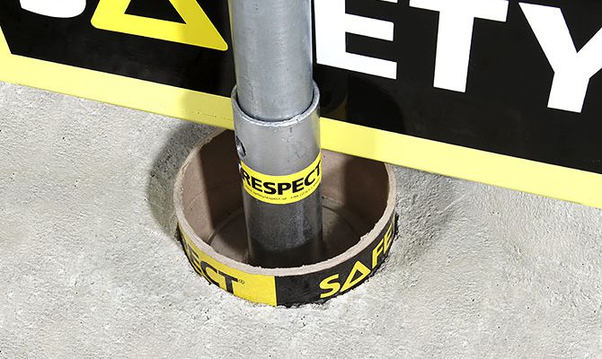 concrete cast protection for edge protection bracket at construction site UK