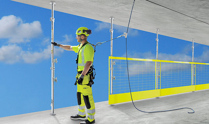 compression posts with edge protection barriers between concrete slabs at construction site