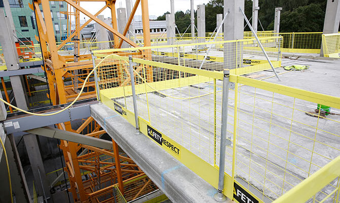 Temporary edge protection on concrete floor slabs at construction site in UK