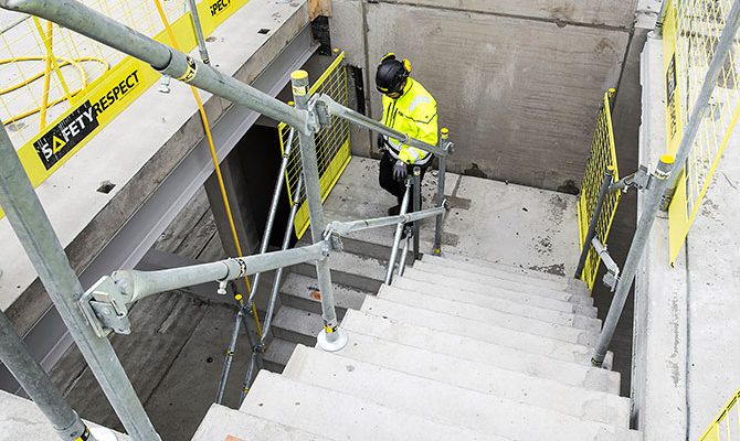 Edge protection on concrete stairs on construction site UK